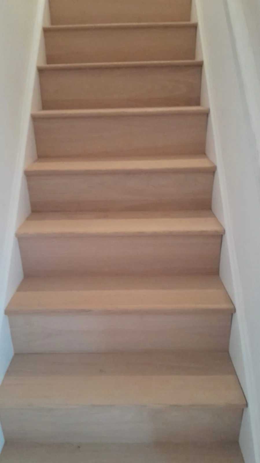 Timber-effect stair covering with matching step nosings